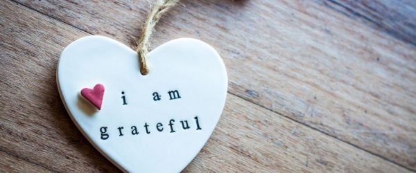 a white heart with the words I am grateful